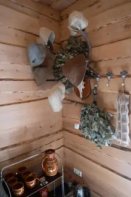 a corner of a room with a wall with wooden walls at Vila Pušyno 4 in Kulautuva
