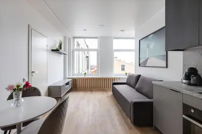 a living room with a couch and a table at Hook Studios Vilnius Old Town in Vilnius