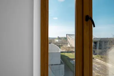 a window with a view of a building at Apartment with balcony and castle view by URBAN RENT in Vilnius