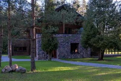 a stone building with trees in front of it at River Mind Villa with SPA in Zalioji