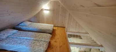 a bedroom with a bed in the corner of a tent at River Mind Villa with SPA in Zalioji