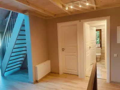a room with a staircase and a blue stair case at River Mind Villa with SPA in Zalioji