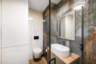 a bathroom with a sink and a mirror at Apartment in the center of Vilnius in Vilnius