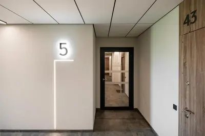 a hallway with a number on the wall at Apartment in the center of Vilnius in Vilnius