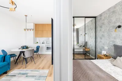 a bedroom and living room with a bed and a dining room at Apartment in the center of Vilnius in Vilnius