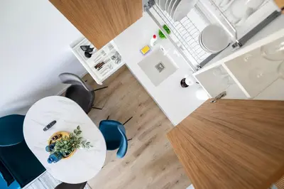 an overhead view of a table and chairs in a room at Apartment in the center of Vilnius in Vilnius