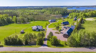 an aerial view of a farm with a group of tents at Sporto ir poilsio centras KORNEALITA IEVALAUKIS in Gaveikėnai