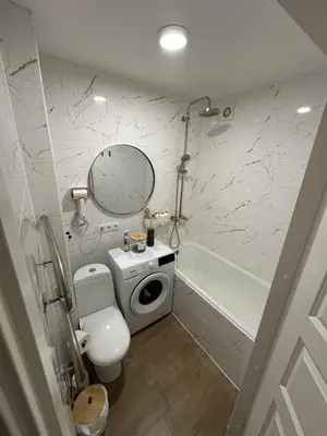 a bathroom with a toilet and a sink and a tub at Moncerat in Šiauliai