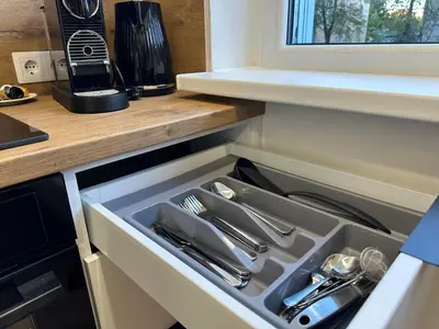 a drawer in a kitchen with utensils in it at Moncerat in Šiauliai