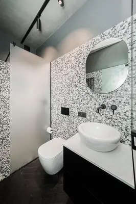 a bathroom with a white sink and a mirror at Jaukus butas Kauno centre in Kaunas