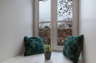 two pillows sitting on a table in front of a window at apartment with jacuzzi, old town in Vilnius