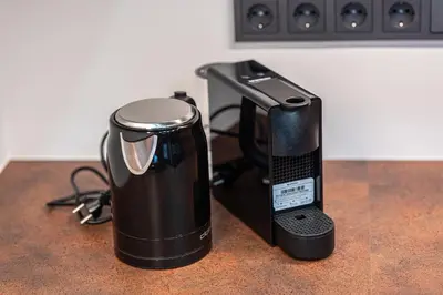 a coffee maker sitting on top of a counter at Modern Oasis in Vilnius Center by Reside Baltic in Vilnius