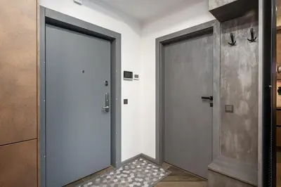 a hallway with two doors and a rug at Modern Oasis in Vilnius Center by Reside Baltic in Vilnius