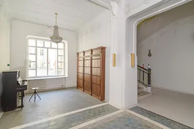 an empty room with a door and a window at Apartment Gedimino 22 in Vilnius