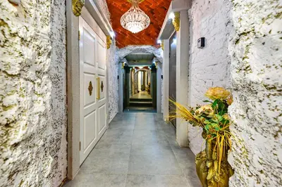a hallway of a building with a vase of flowers at HOST apartment 3 in Kaunas