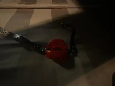 a red object is sitting on the floor at FETISH Room in Kaunas