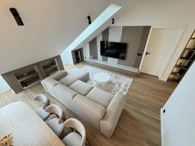 a living room with a couch and a tv at ᴄᴏʜᴏsᴛ I 2BD Penthouse Luxury-Designer Apt, CityCenter in Kaunas