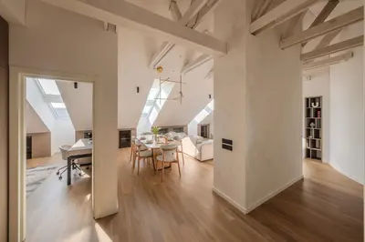 an open living room and dining room with skylights at ᴄᴏʜᴏsᴛ I 2BD Penthouse Luxury-Designer Apt, CityCenter in Kaunas
