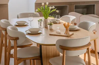 a dining room with a wooden table and chairs at ᴄᴏʜᴏsᴛ I 2BD Penthouse Luxury-Designer Apt, CityCenter in Kaunas
