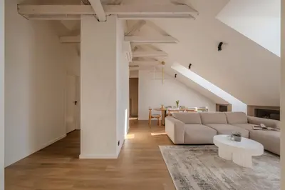a living room with a couch and a table at ᴄᴏʜᴏsᴛ I 2BD Penthouse Luxury-Designer Apt, CityCenter in Kaunas