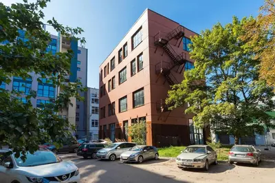 a group of cars parked in front of a building at Artsy Design Loft - Hip District Uptown Vilnius in Vilnius