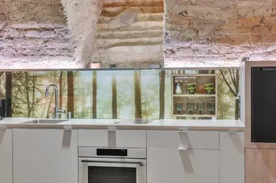 a kitchen with a sink and a counter top at Historic & modern Arch-Studio - ArcLoft07 in Vilnius