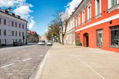 a cobblestone street in a city with buildings at Historic & modern Arch-Studio - ArcLoft07 in Vilnius