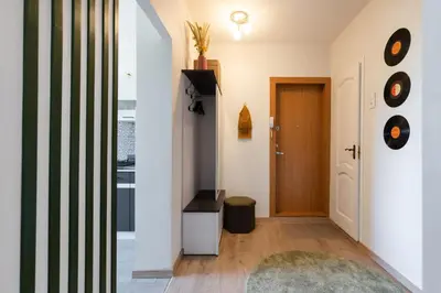 a hallway of a house with a door at Spirit Of 70s Apartment in Vilnius