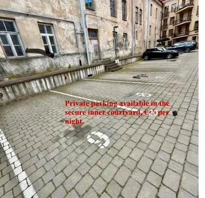 a picture of a street with a sign on it at Happy Inn Lux apartment, self Check, parking, Tilto str in Vilnius
