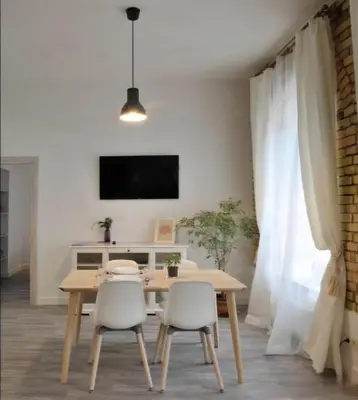 a dining room with a table and two chairs at Happy Inn Lux apartment, self Check, parking, Tilto str in Vilnius
