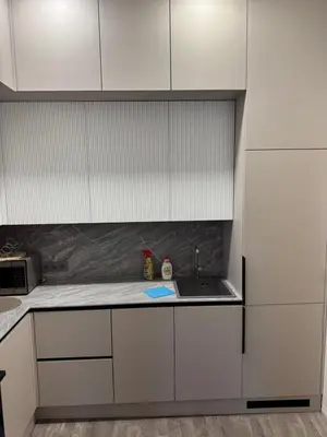 a kitchen with white cabinets and a sink at Happy Inn Lux apartment, self Check, parking, Tilto str in Vilnius