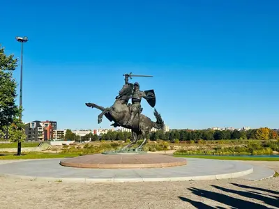 a statue of a man riding a horse at Modern 1-Bedroom Apartment in Kaunas Downtown in Kaunas