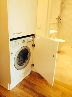 a laundry room with a washer and dryer in a bathroom at Apartment in Druskininkai Lithuania in Druskininkai