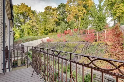 a balcony with a view of a garden at Sunrise Uzupis Apartment in Vilnius