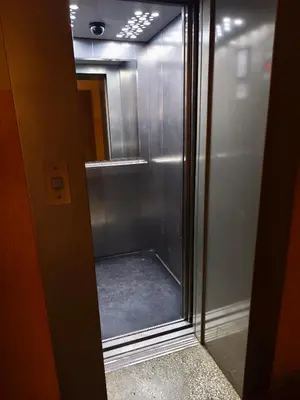 a glass door of a shower in a bathroom at Mocha Apartment in Druskininkai