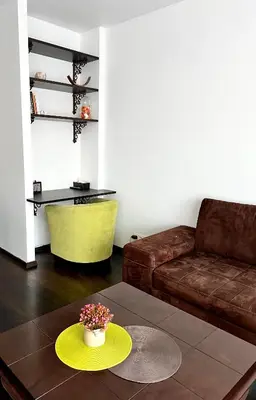 a living room with a couch and a table at Zygio Apartamentai in Vilnius