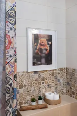 a bathroom with a picture of a person in a mirror at Vilnius Pinewood Apartment in Vilnius
