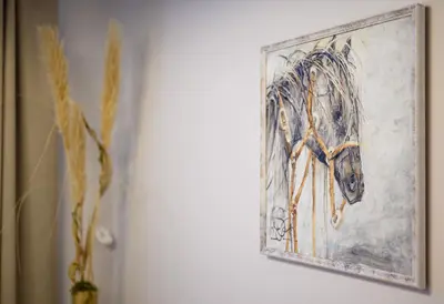 a painting of a horse on a wall at 2BD NEW Apt w-Balcony I Parking inc I next to the River and Forest I by Cohost in Birštonas