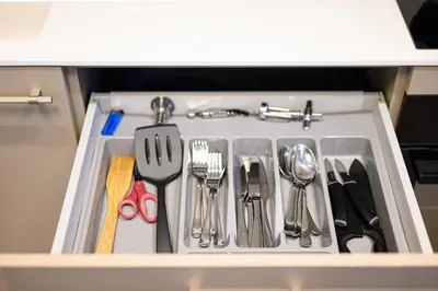 a drawer filled with utensils in a kitchen at 2BD NEW Apt w-Balcony I Parking inc I next to the River and Forest I by Cohost in Birštonas