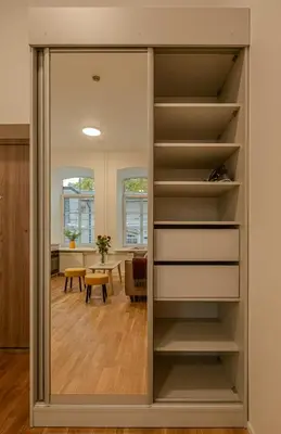 a sliding glass door leading into a room with a dining room at Railway Apartments in Vilnius