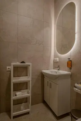 a bathroom with a sink and a mirror at Railway Apartments in Vilnius