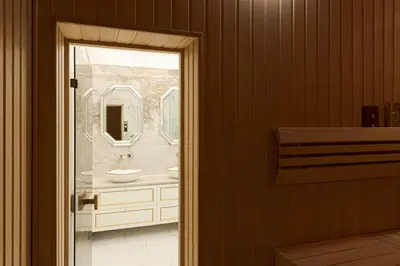 a bathroom with a sink and a mirror at Luxury villa with sauna in the pine forest close to Vilnius city centre in Vilnius