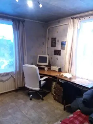 an office with a desk with a computer and a chair at Degesiai in Degėsiai