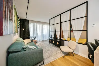 a living room with a couch and a chair at Old Town Luxury Apartments in Vilnius