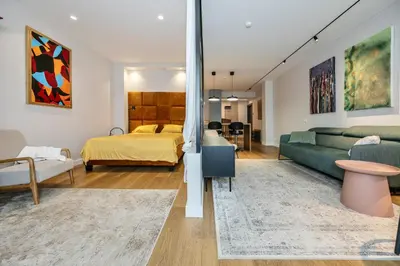 a living room with a bed and a couch at Old Town Luxury Apartments in Vilnius