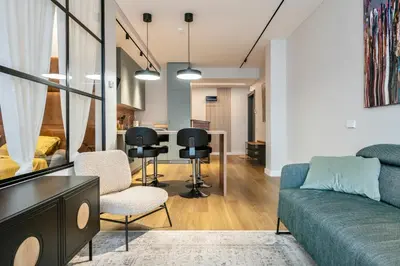 a living room with a couch and chairs and a table at Old Town Luxury Apartments in Vilnius