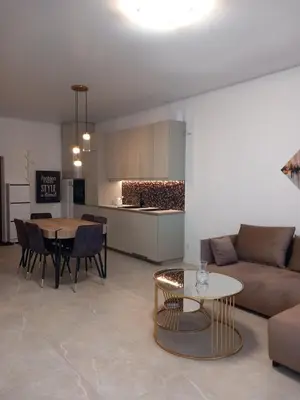 a living room with a couch and a table at SPA TOWN house II in Druskininkai