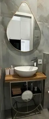 a bathroom with a white sink and a mirror at SPA TOWN house II in Druskininkai