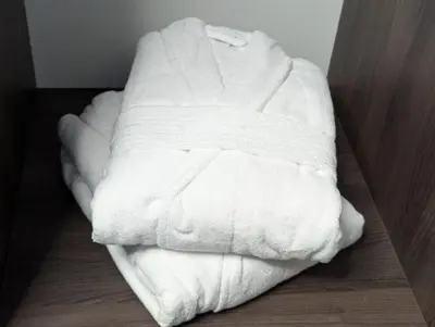 a white towel sitting on the floor in a room at Durpyno 3c SELF CHECK-IN in Panevėžys