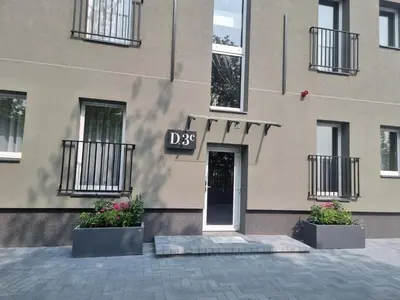 a building with a sign that says dsp on it at Durpyno 3c SELF CHECK-IN in Panevėžys